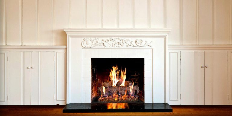 A classic fireplace with a Vented gas log set