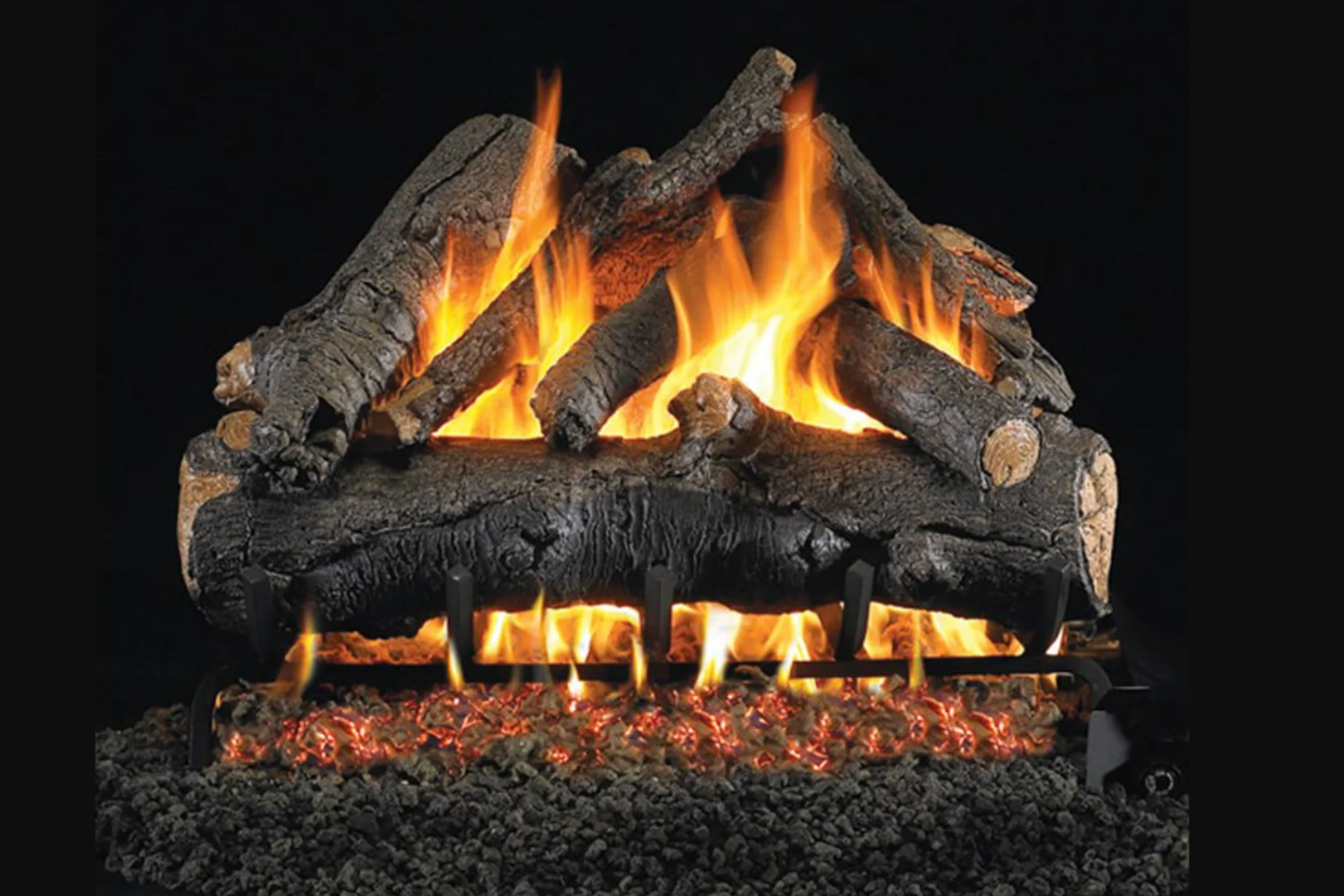 A Vented Oak-style gas log set with organic knobs and split ends on a black background. 