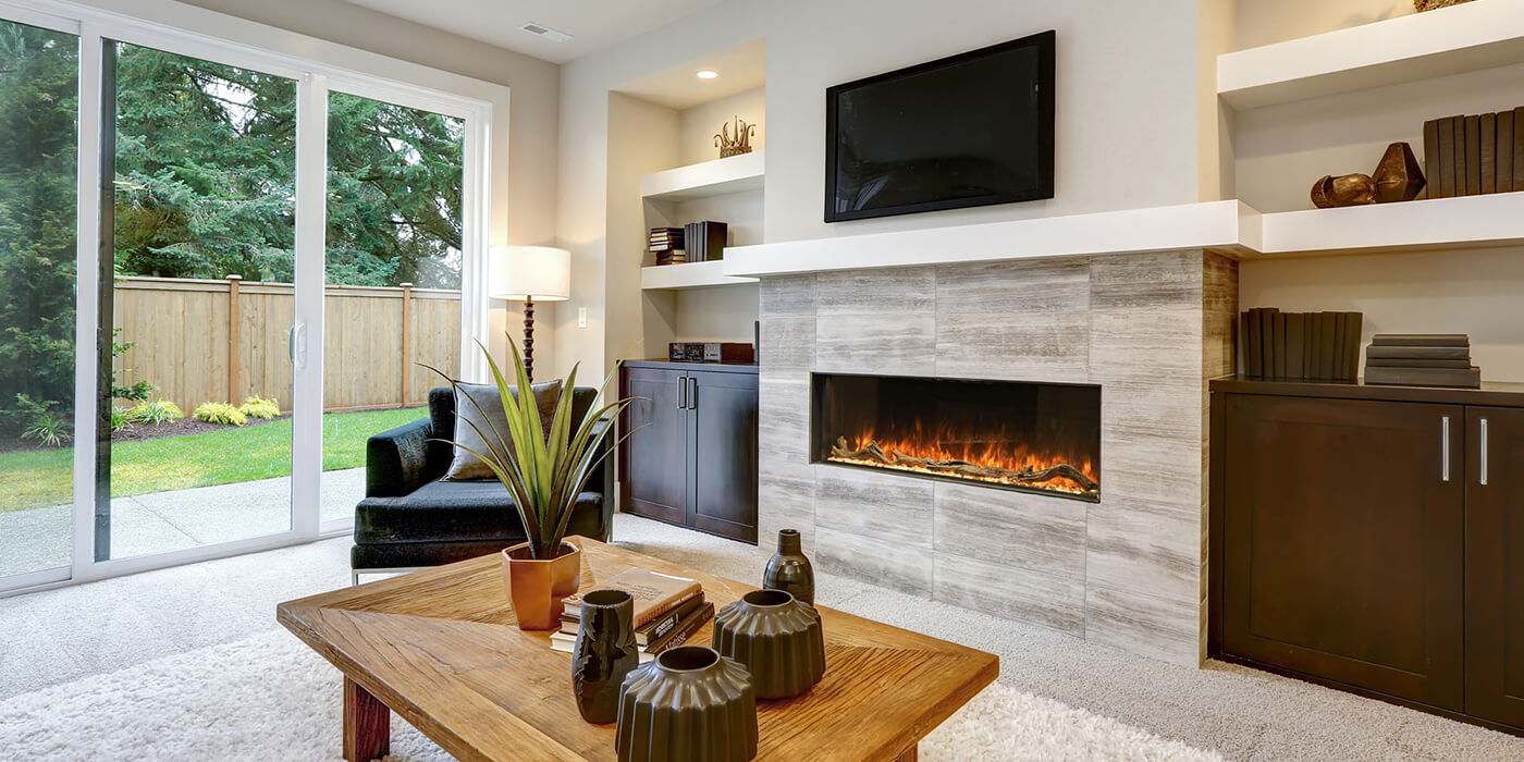 A modern living room with a built-in linear electric fireplace under a mantel and TV