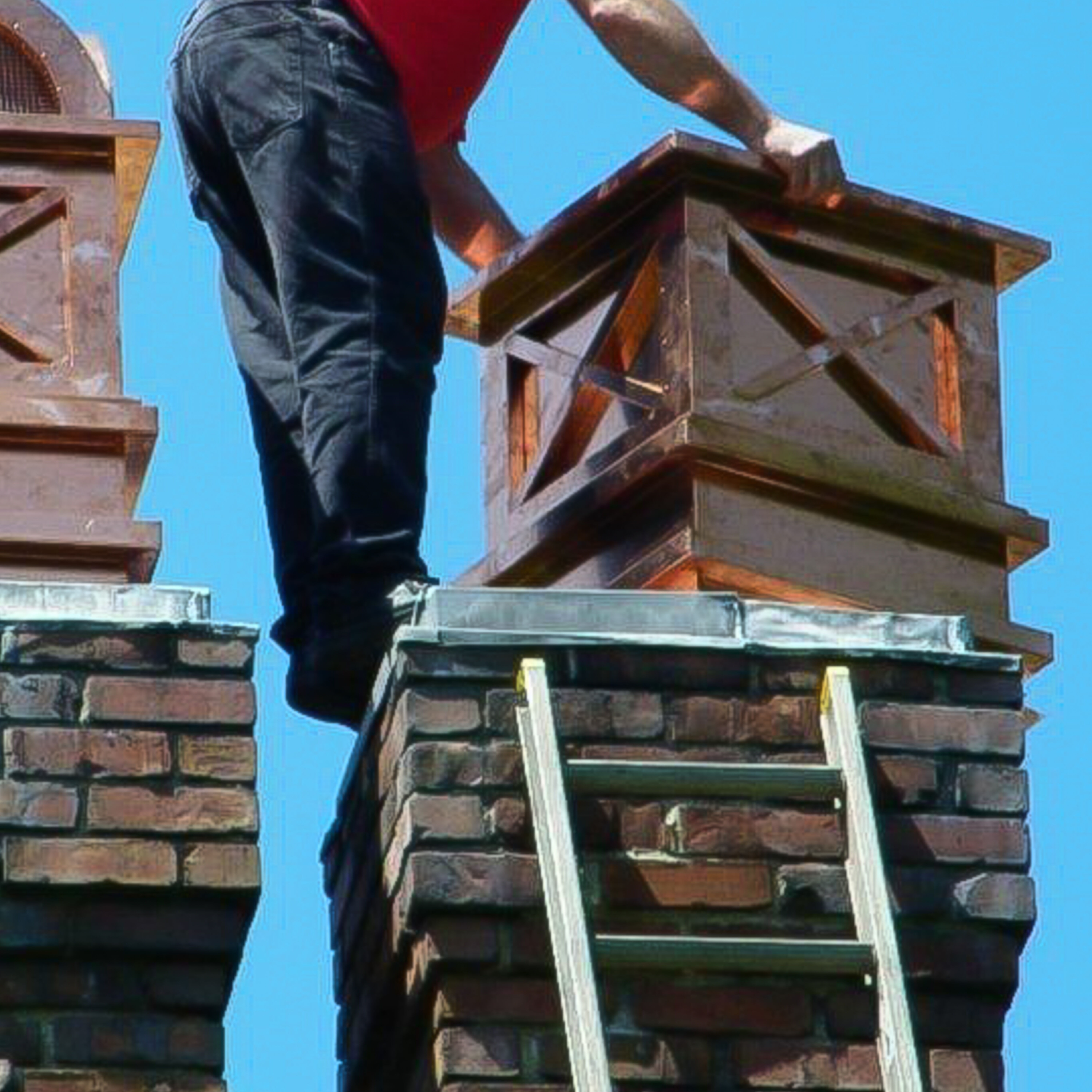 this is a photo of a professional chimney sweep performing a chimney inspection, cleaning, and repair 