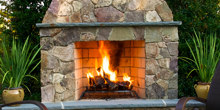 An outdoor wood burning fireplace