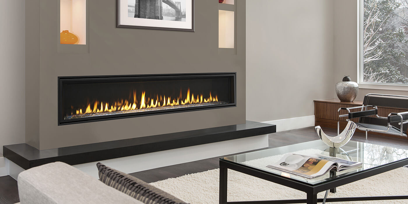 A large, linear gas fireplace installed in a modern living room