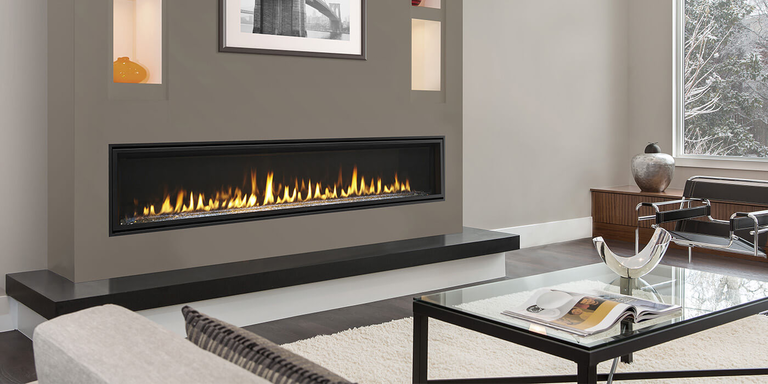 A large, linear gas fireplace installed in a modern living room