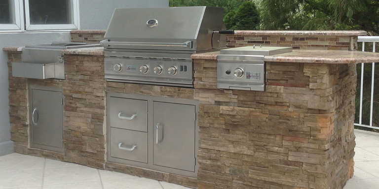 An small, straight outdoor kitchen island finished with bricks