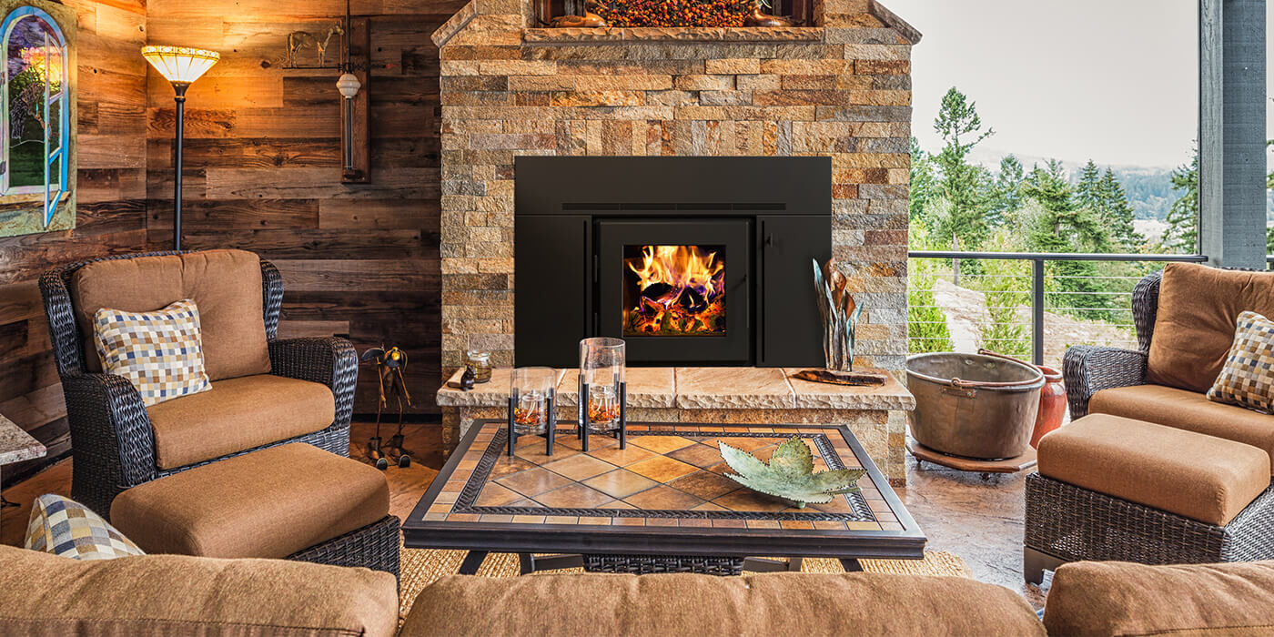 A rustic living room with a classic brick fireplace and a wood burning fireplace insert