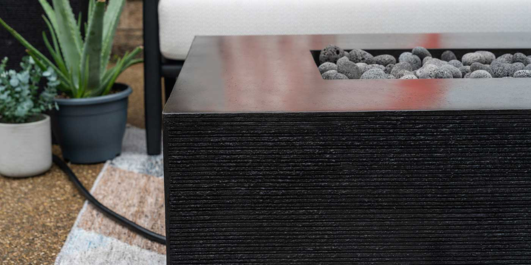 A close-up of the Zen Gas Fire Pit showing its unique raked texture that resembles a Zen Garden