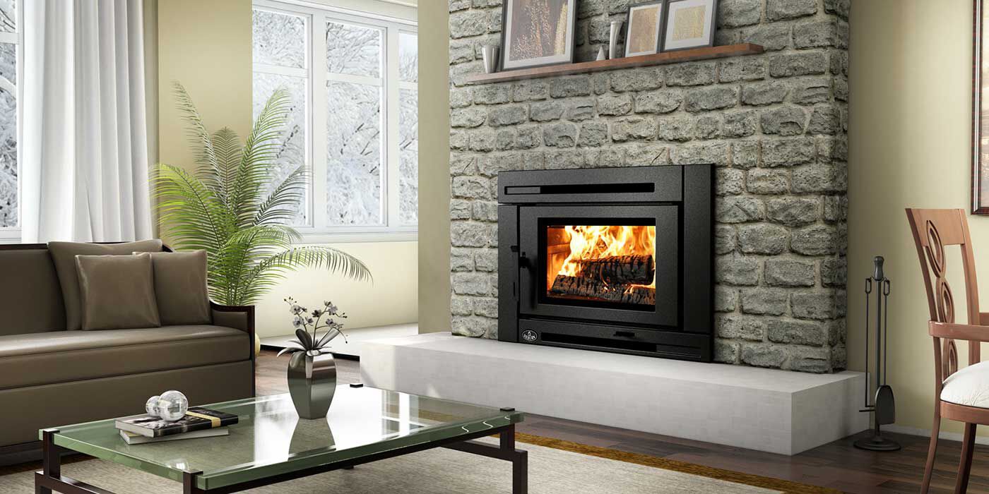 A contemporary living room with a wood fireplace that has been upgraded with a traditional wood burning stove insert.