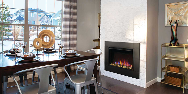 A contemporary dining room with a traditional Napoleon gas fireplace