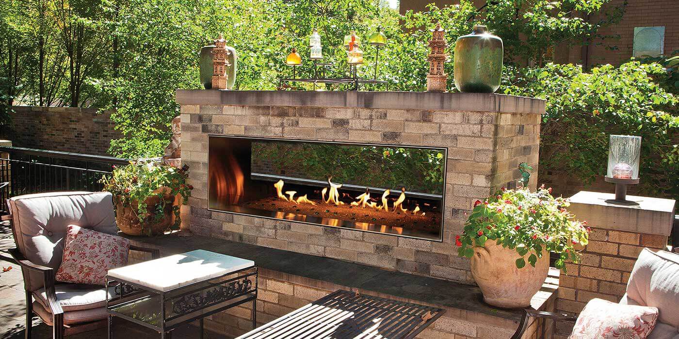 The Carol Rose linear see-through gas fireplace has three flame speeds and multi-colored accent lighting, so you can set the perfect mood for all your outdoor gatherings.