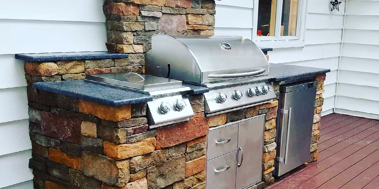 A small, straight-shaped outdoor kitchen island