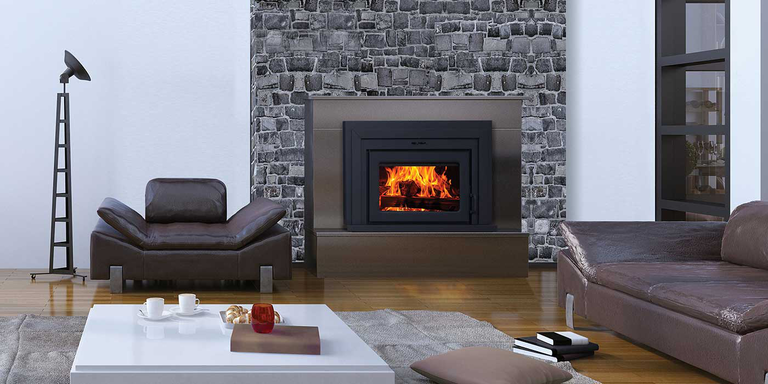 A modern-industrial living space with a natural stone hearth and a wood burning fireplace insert.