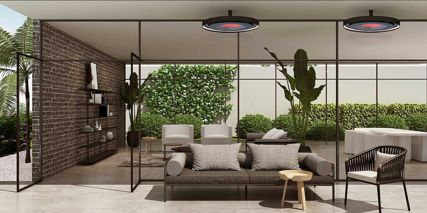 A contemporary outdoor living space with two Bromic Eclipse patio heaters installed on the ceiling.