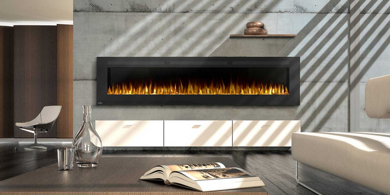 An industrial living room with dark wood floors, an exposed cement hearth with a large, linear gas fireplace, plain white furniture, and a large wood coffee table.