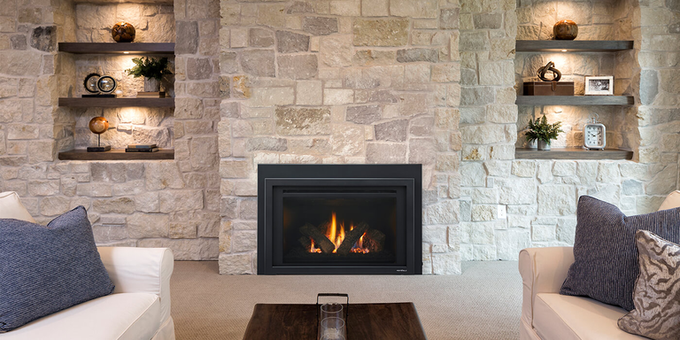 A square shaped Direct Vent gas fireplace installed on a natural stone wall with built-in shelving
