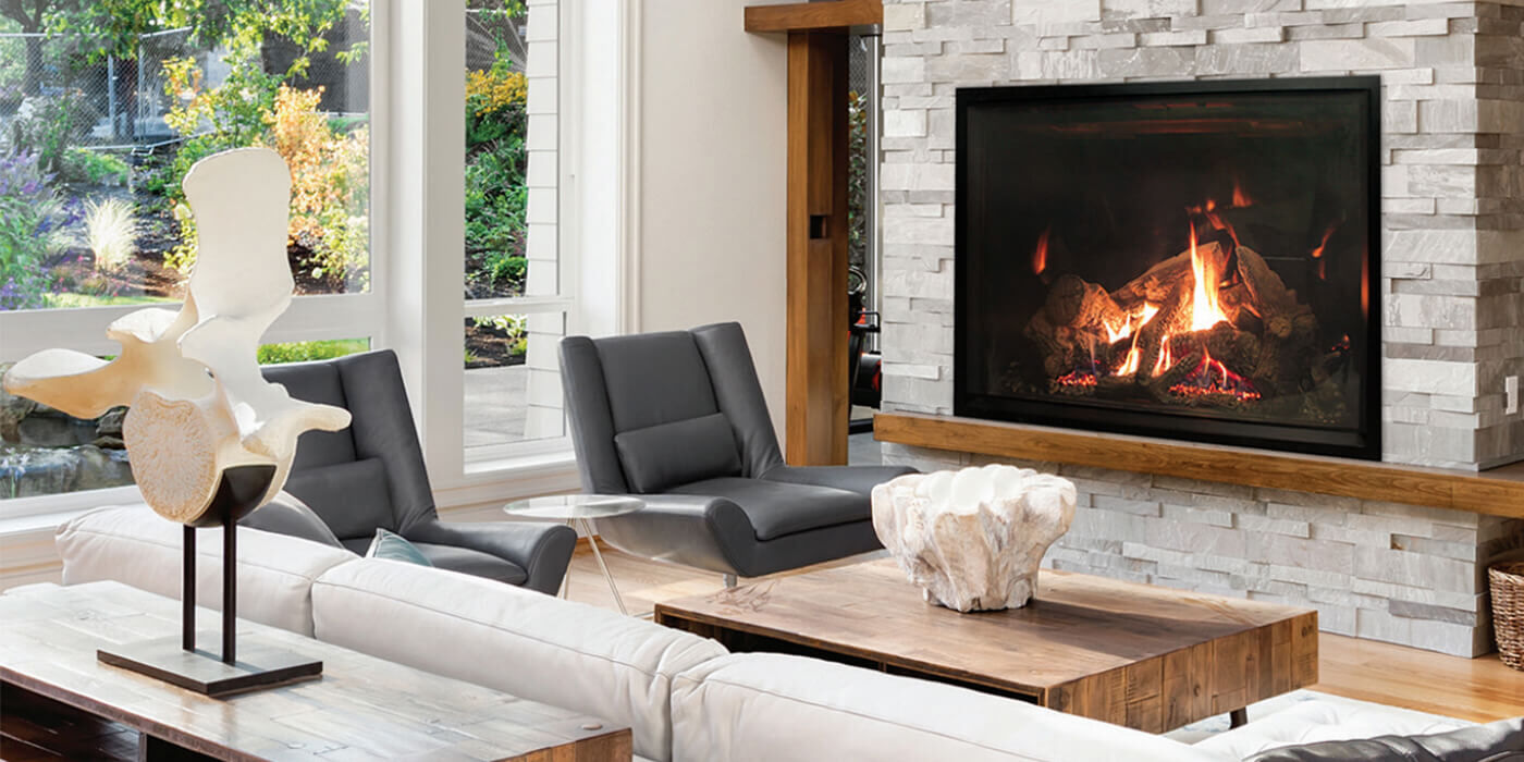 A large, square-shaped traditional wood burning fireplace 