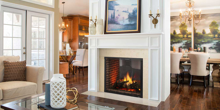 A traditional living room and dining room separated by a classic, square see-through gas fireplace