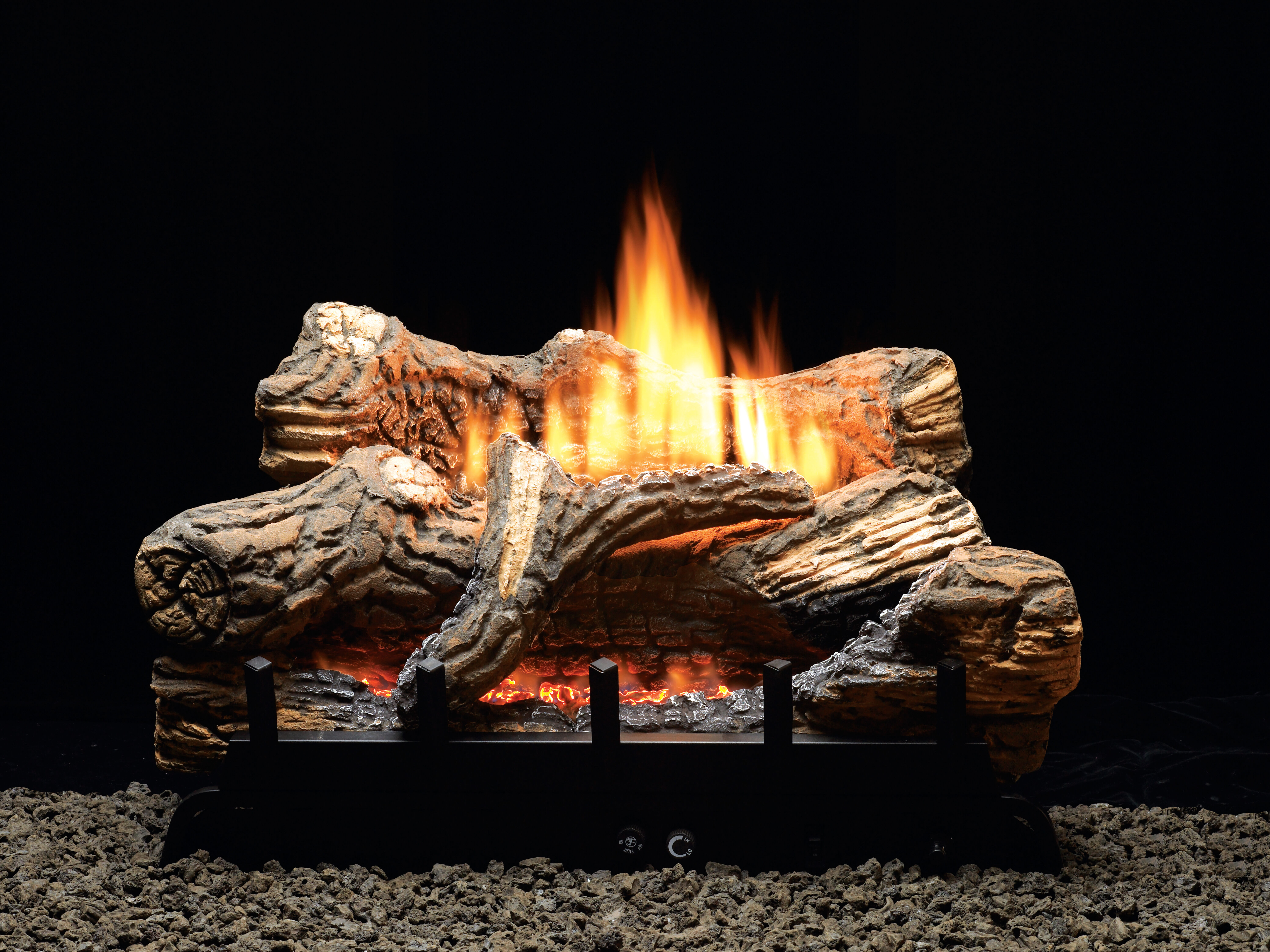 The Flint Hill gas log set by Empire features a rustic finish, a traditional-looking burner system, and adjustable flames.