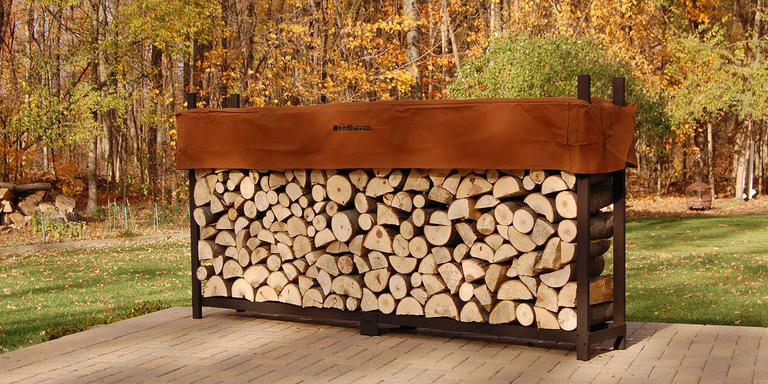 An extra-large firewood rack with 1/2 cord of firewood