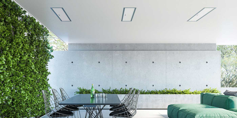 A contemporary enclosed patio space with two Bromic electric heaters mounted to the ceiling 