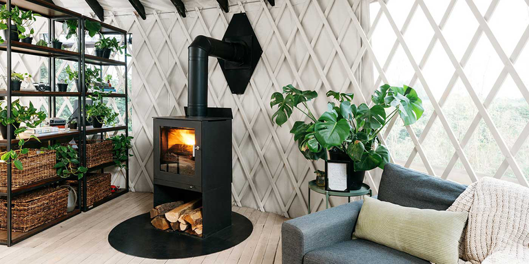 A black wood burning stove installed a Yurt 