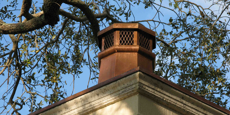 A decorative metal chimney cap