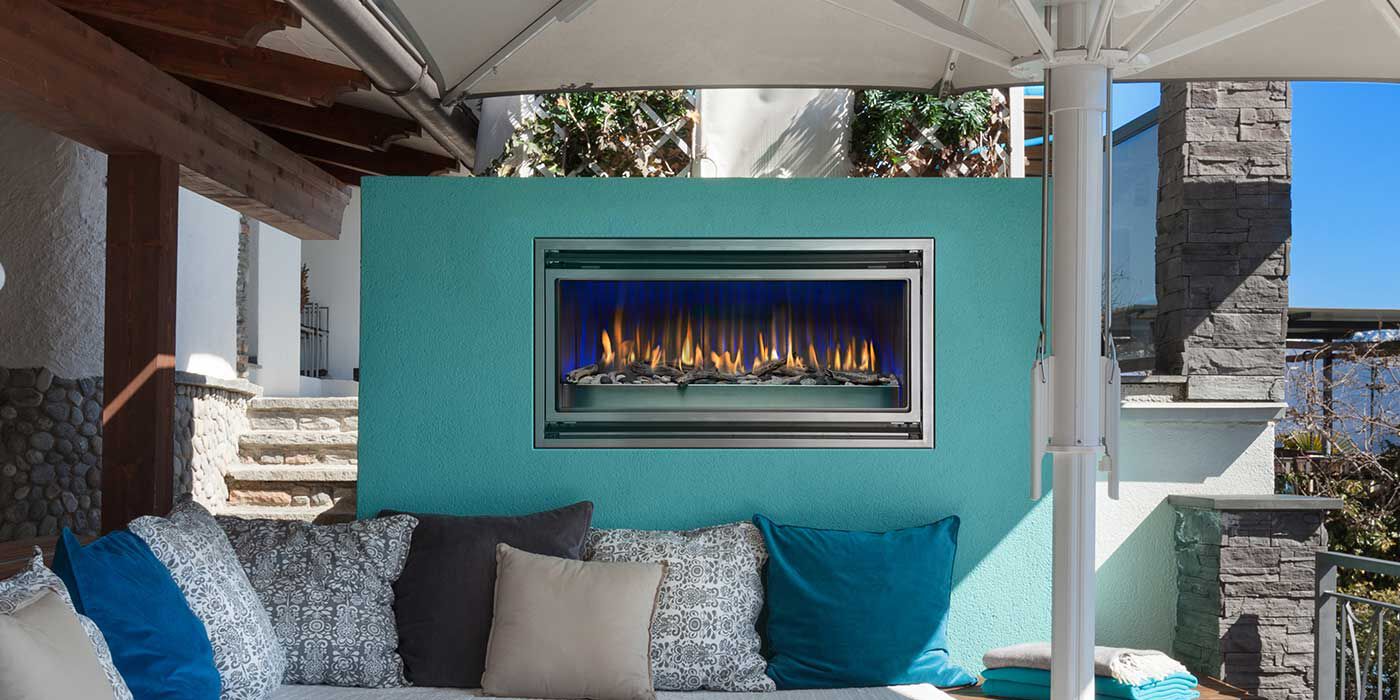 The Mahana gas fireplace from Montigo can be mounted to the wall or installed in a colorful, standalone enclosure.