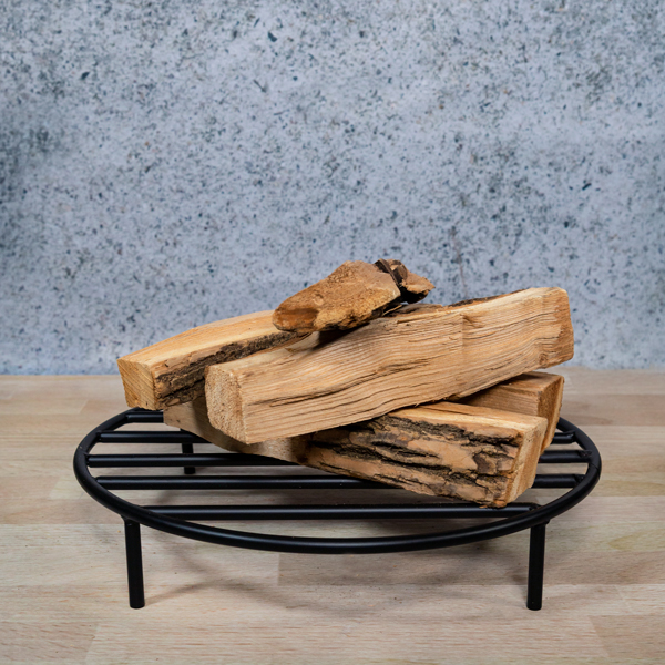 Black steel fire ring grate with wood logs