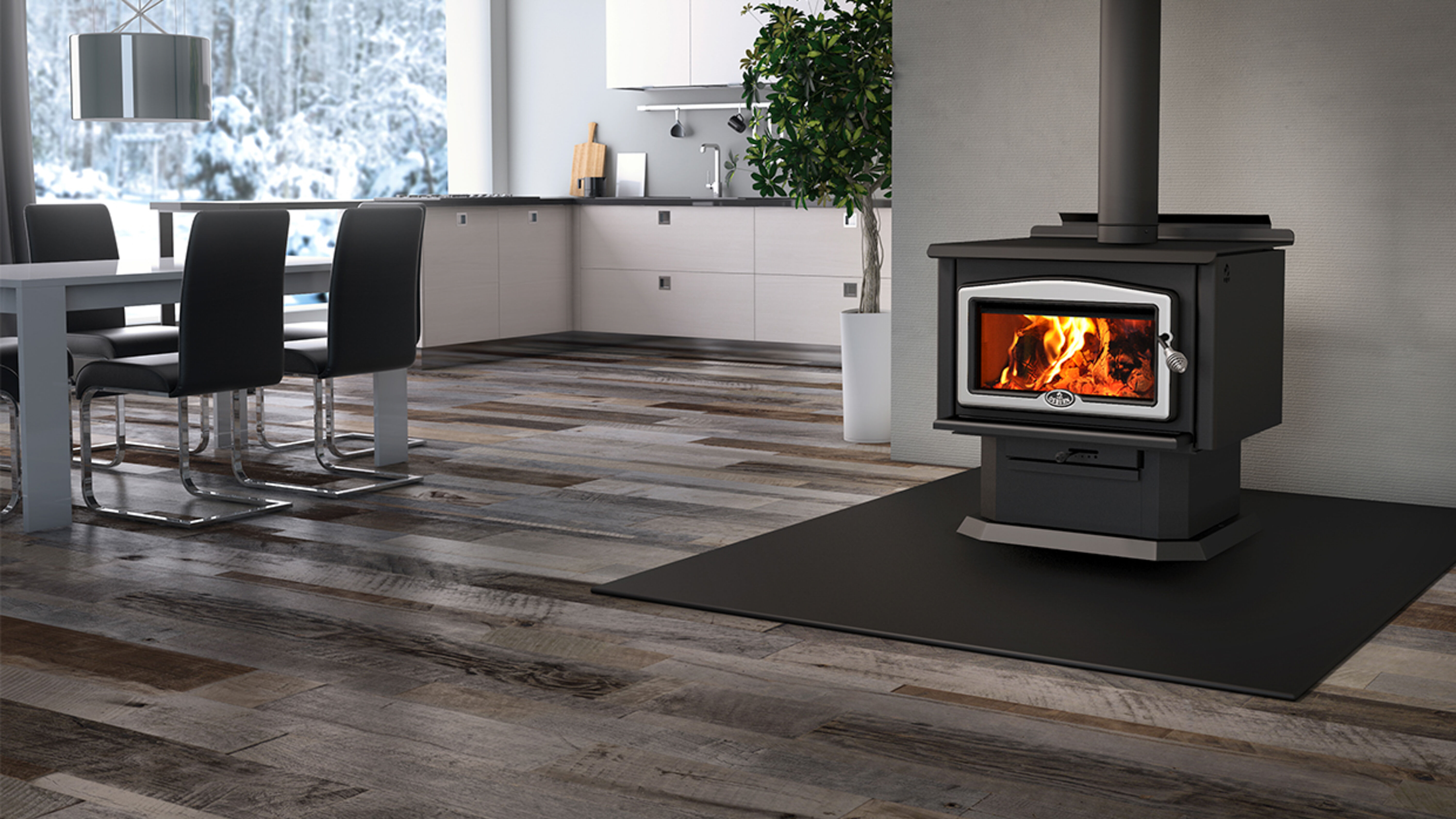 A modern dining room and kitchen area with a white table and black metal chairs, and large, black cast-iron wood burning stove on a platform.