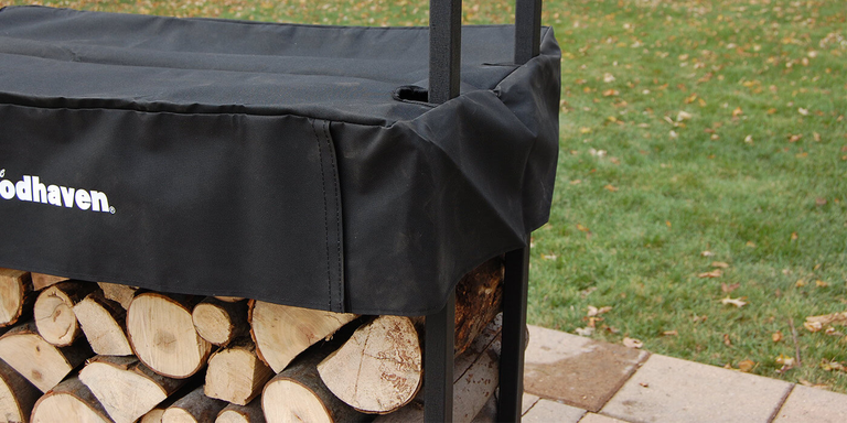 A Woodhaven black firewood rack with a matching cover