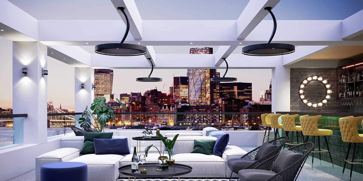 A contemporary outdoor lounge with Bromic Eclipse electric patio heaters mounted to the ceiling