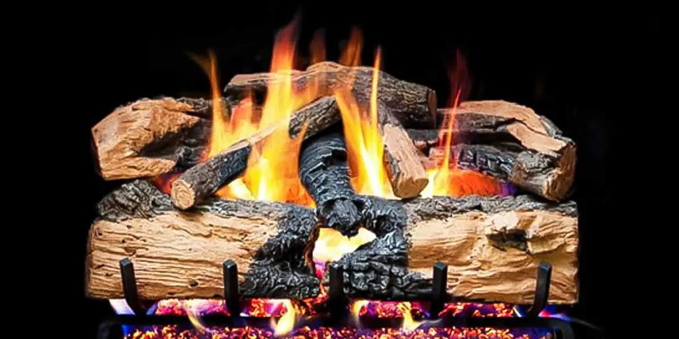 A Ventless gas log set with natural splitting, and a charred bark finish on a black background. 