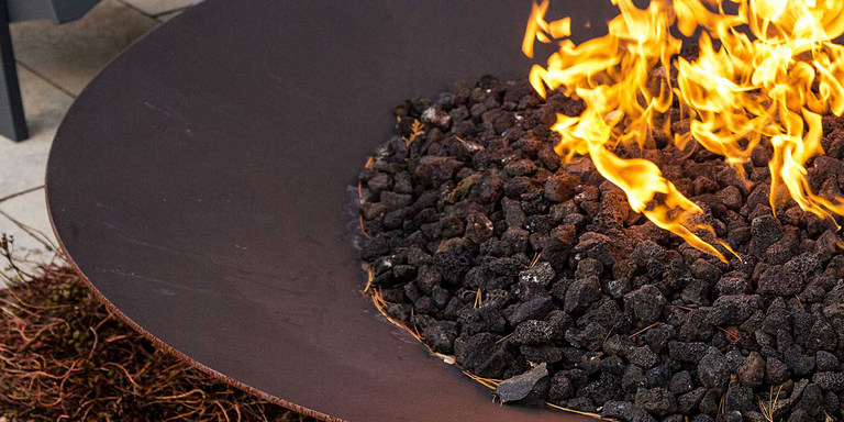 A close-up of the steel Asia Gas Fire Pit