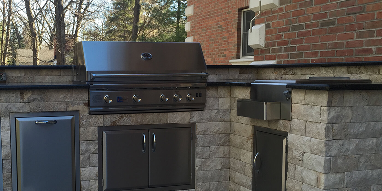 An outdoor kitchen island finished with bricks