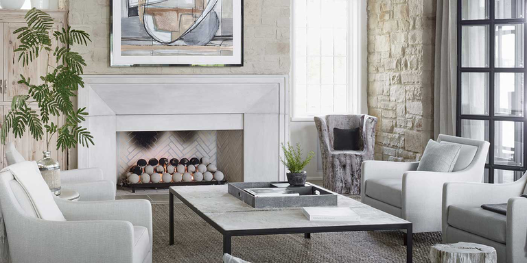 A contemporary living room with a large, linear direct vent gas fireplace