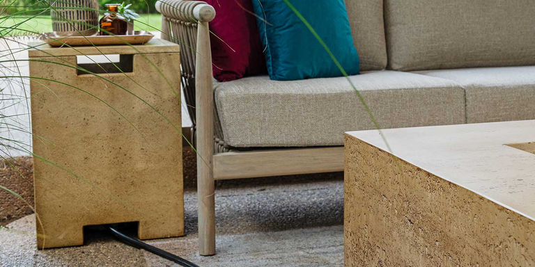 The FlameCraft Tuscan Gas Fire Pit with a matching side table Propane tank enclosure