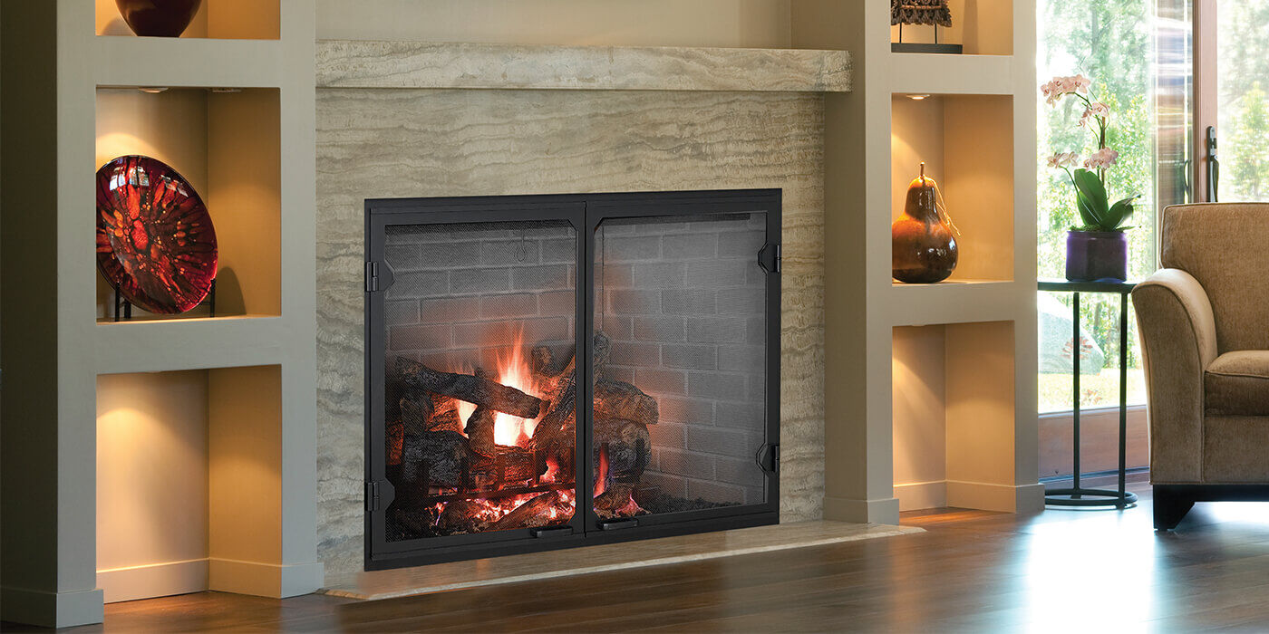 A large, square gas fireplace with modern glass fireplace doors A large, square gas fireplace with modern glass fireplace doors