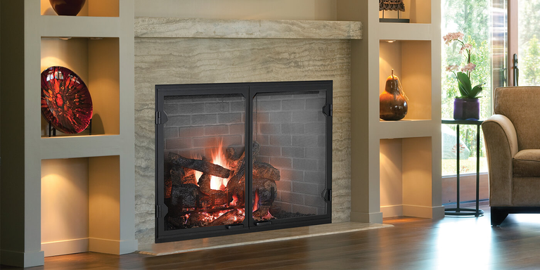 A large, square gas fireplace with modern glass fireplace doors