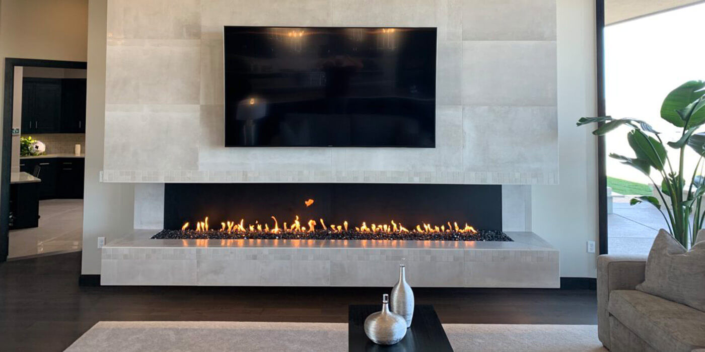 A modern indoor living room with a linear gas fireplace