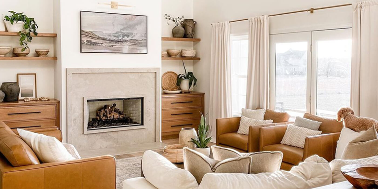 A modern farmhouse style living room with a linear gas fireplace and a rustic gas log set
