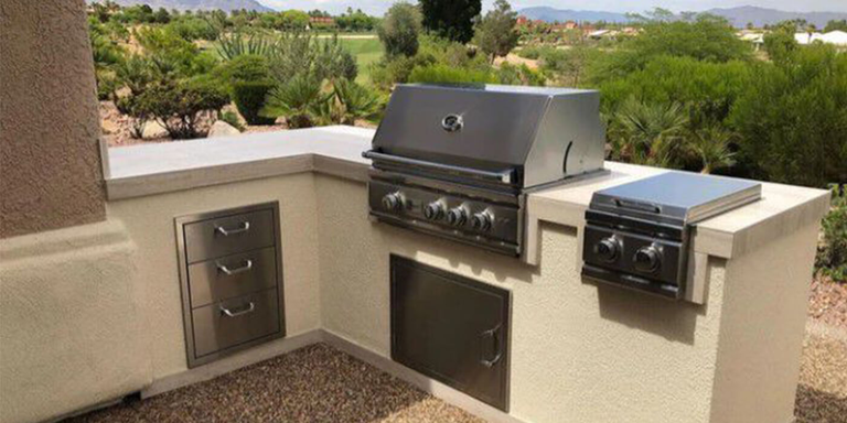 An outdoor kitchen island finished with stucco