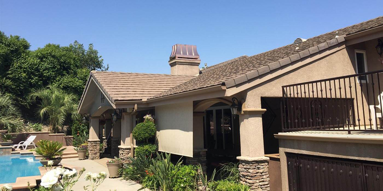 A stainless steel chimney shroud from American Chimney Shroud