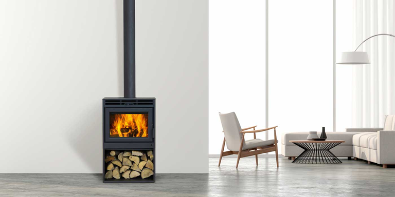 A modern living space with a wood burning stove and a sitting area in the background