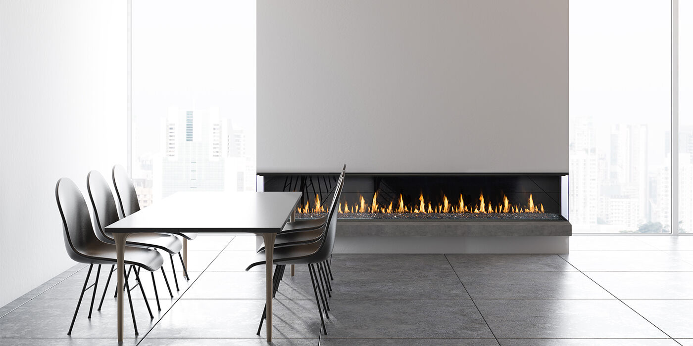 The 100" linear Prodigy gas fireplace from Montigo installed in a modern dining room