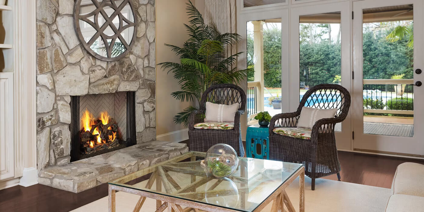 A traditional living room with a classic wood burning fireplace 