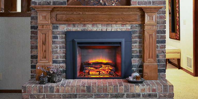 A classic fireplace converted with a realistic looking electric fireplace insert