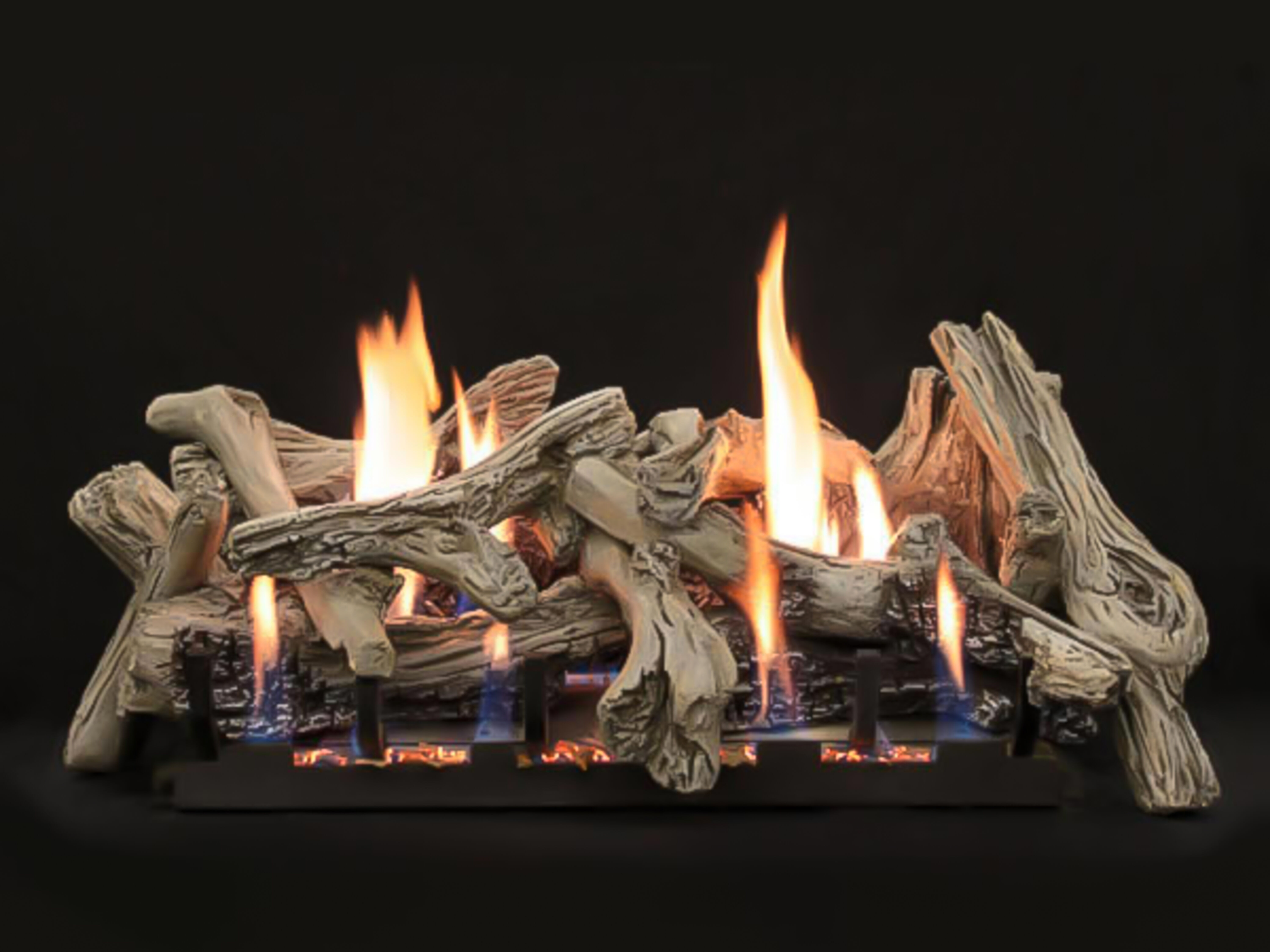 The Driftwood Burncrete gas log set by Empire features a beachy, weathered finish and natural-looking flames.