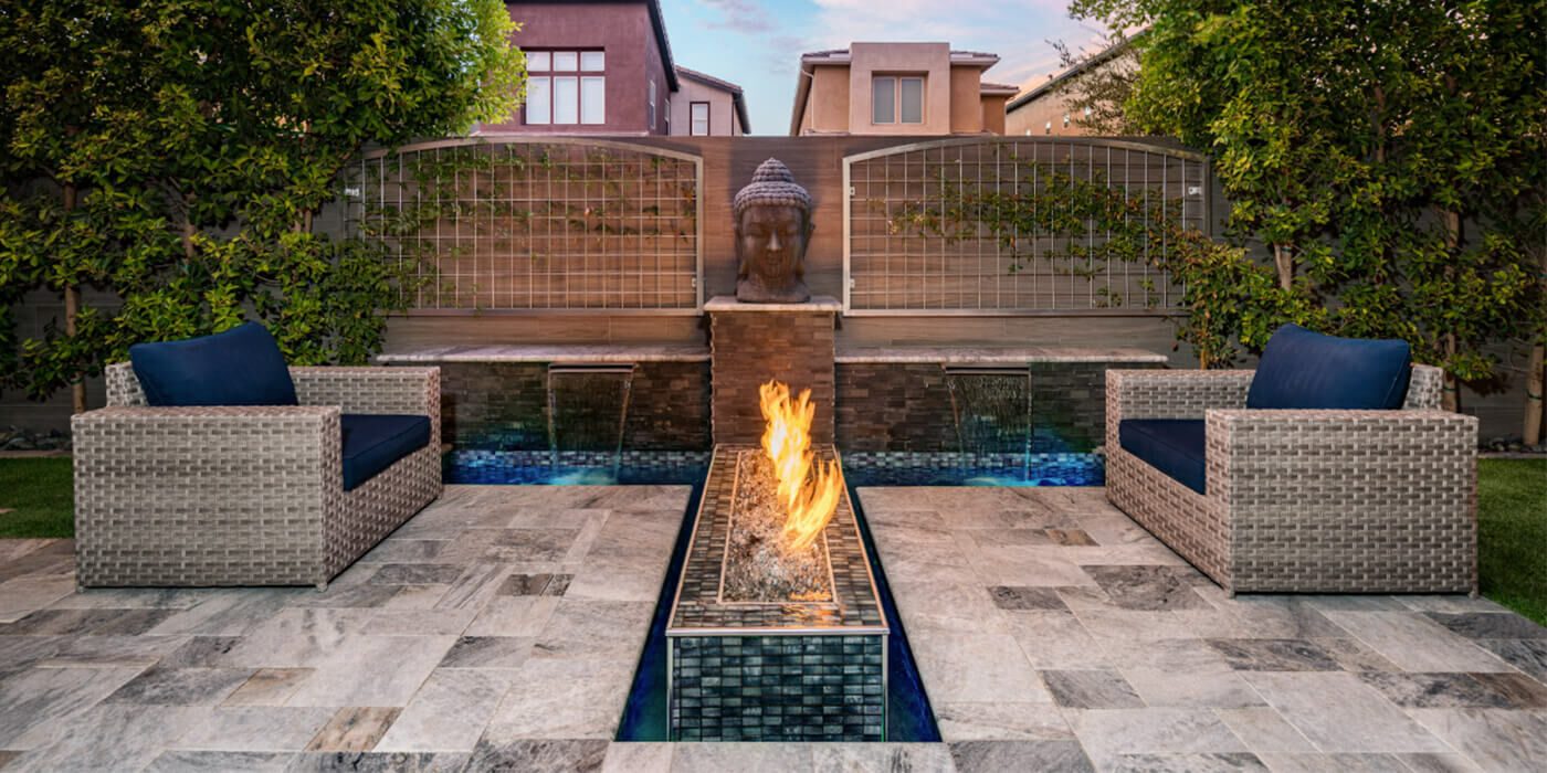 A serene outdoor space with a custom linear gas fire pit by The Outdoor Plus