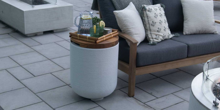 A side table Propane tank enclosure that matches the ReForm Stack Gas Fire Pit by FlameCraft