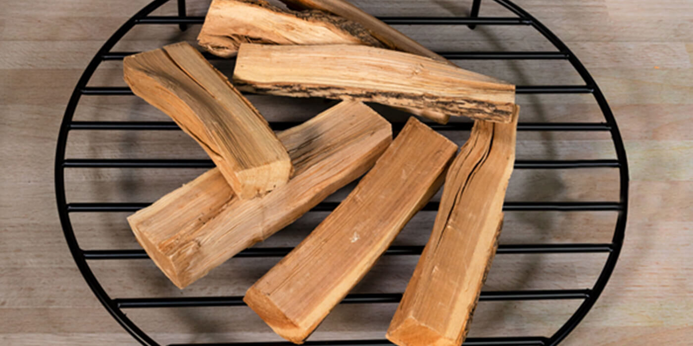 A black steel wood burning fire pit grate