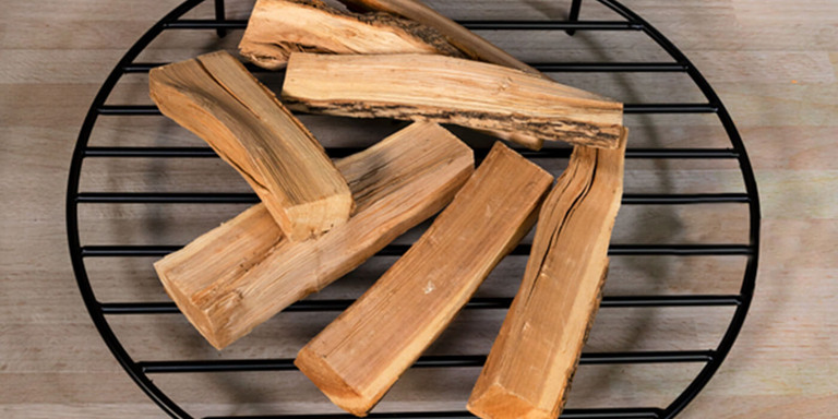 A black steel wood burning fire pit grate